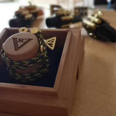 Saxophone or clarinet ligature packed in an exclusive package