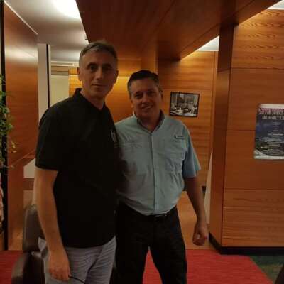 Two men wearing casual attire.
