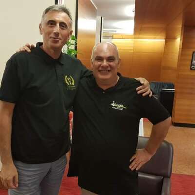 Two men wearing casual attire.