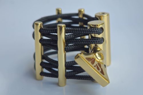 black ligature, brass